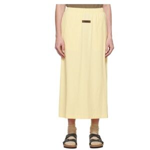BNWOT FEAR OF GOD ESSENTIALS logo-patch straight skirt size M in light yellow